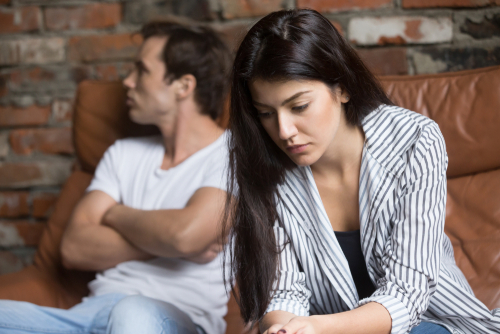 Unhappy young couple, contact a family law attorney in Boise if you're going through a divorce